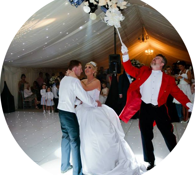 Toastmaster popping a balloon during the first dance